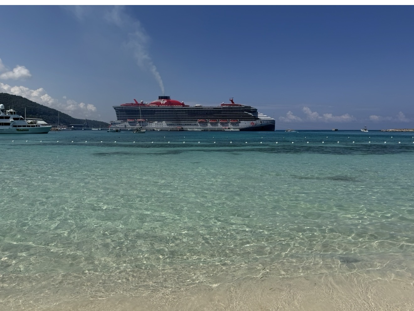 Cruise ship docked in Ocho Rios, Jamaica, with turquoise water in the foreground
