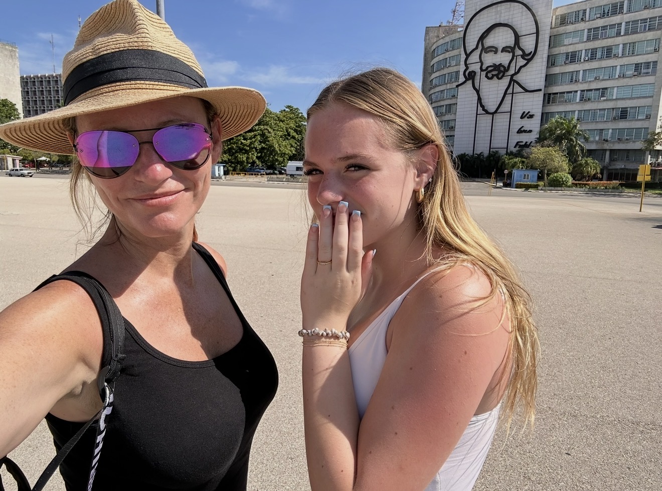 Mother and daughter selfie in front of the Camilo Cienfuegos mural in Havana, Cuba